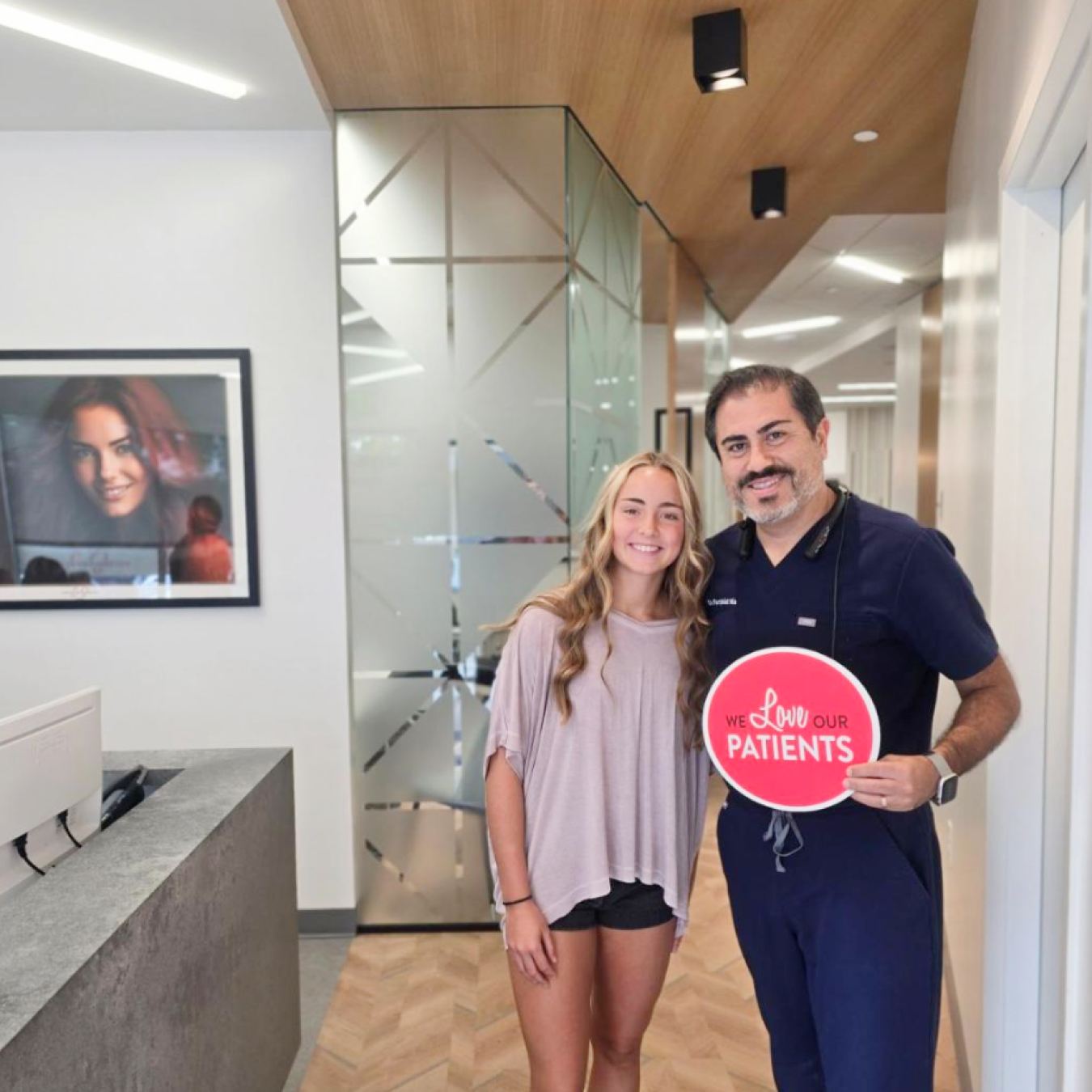 Dr. Mia and a patient posing for a picture