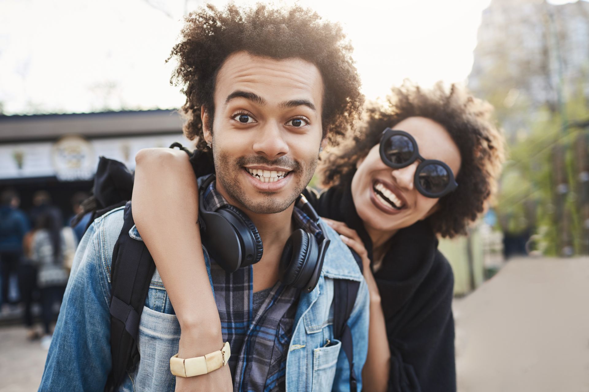 Two people outside smiling