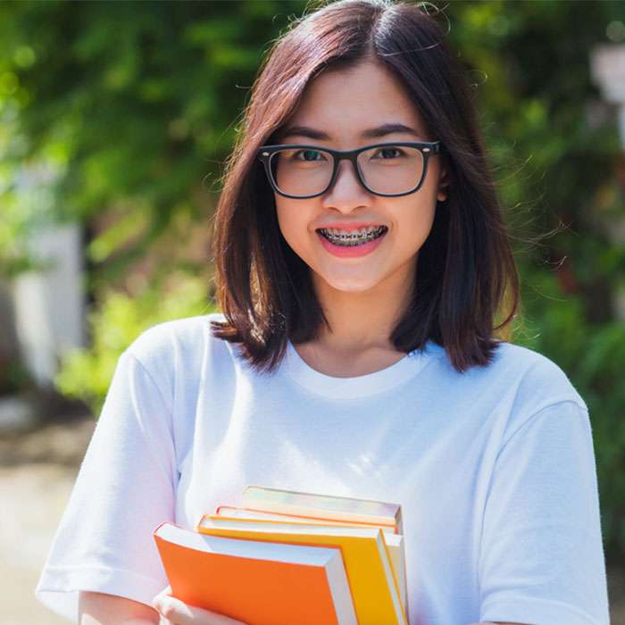 Girl with braces headed to school after a ortho exam at Canton Orthodontics