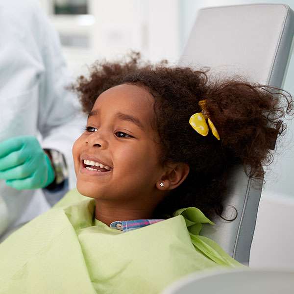 Girl smiling during her dental exam at Canton Orthodontics